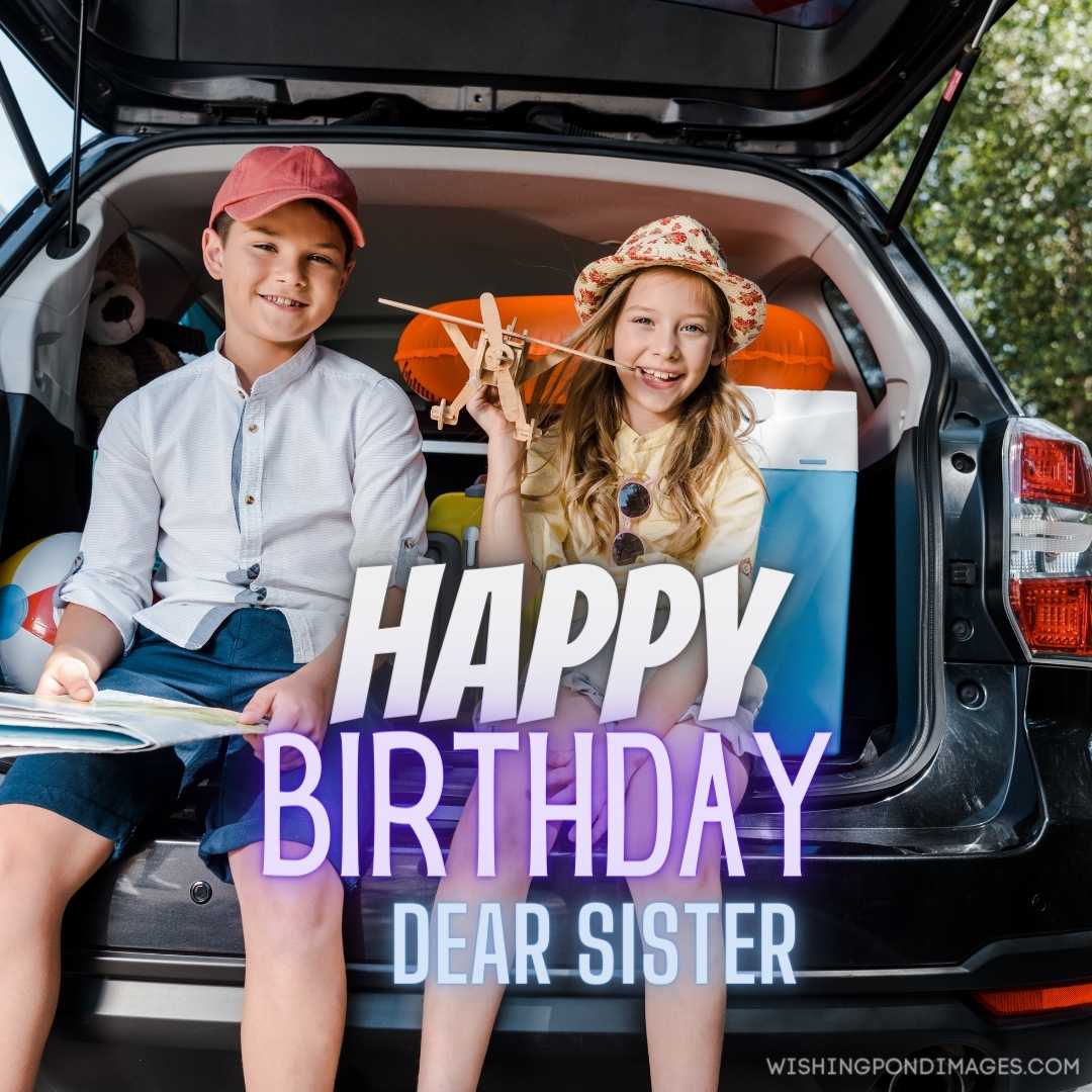 Cheerful sister sitting near a brother and holding a toy biplane. Happy Birthday Sister Images